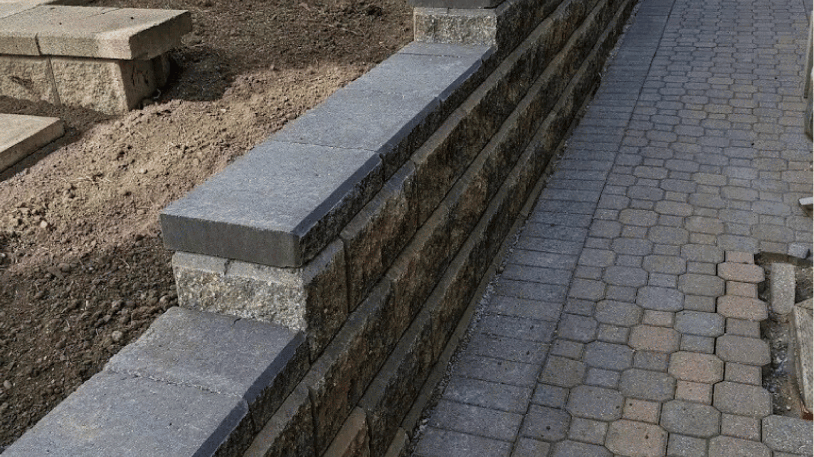 All The Moore Landscaping team building durable retaining walls
