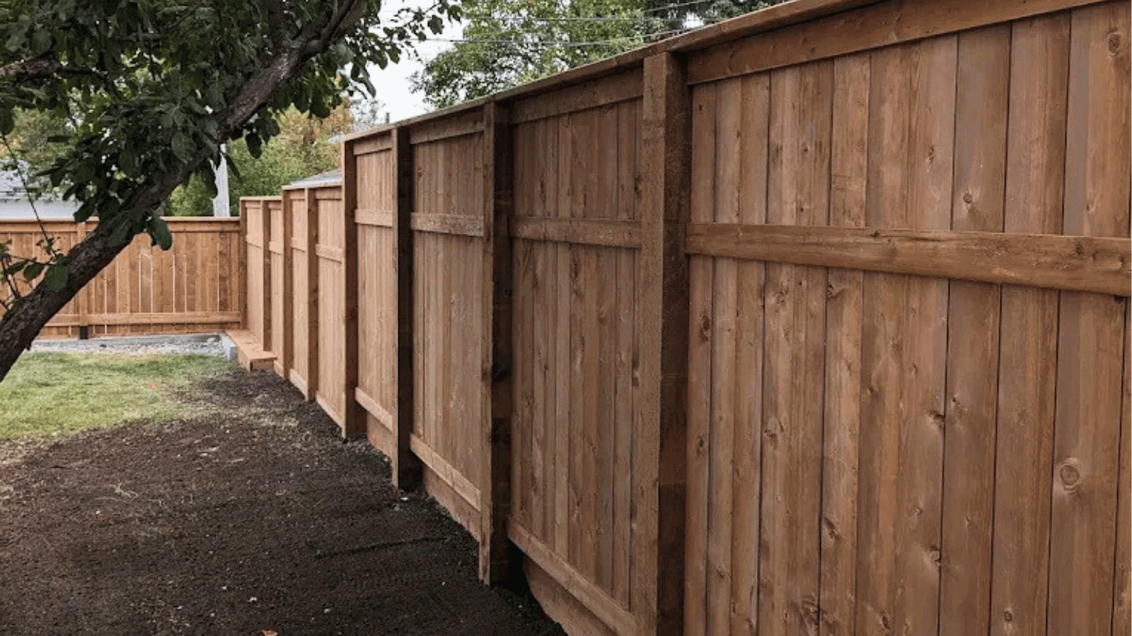 Wooden fence and deck installation underway by skilled team