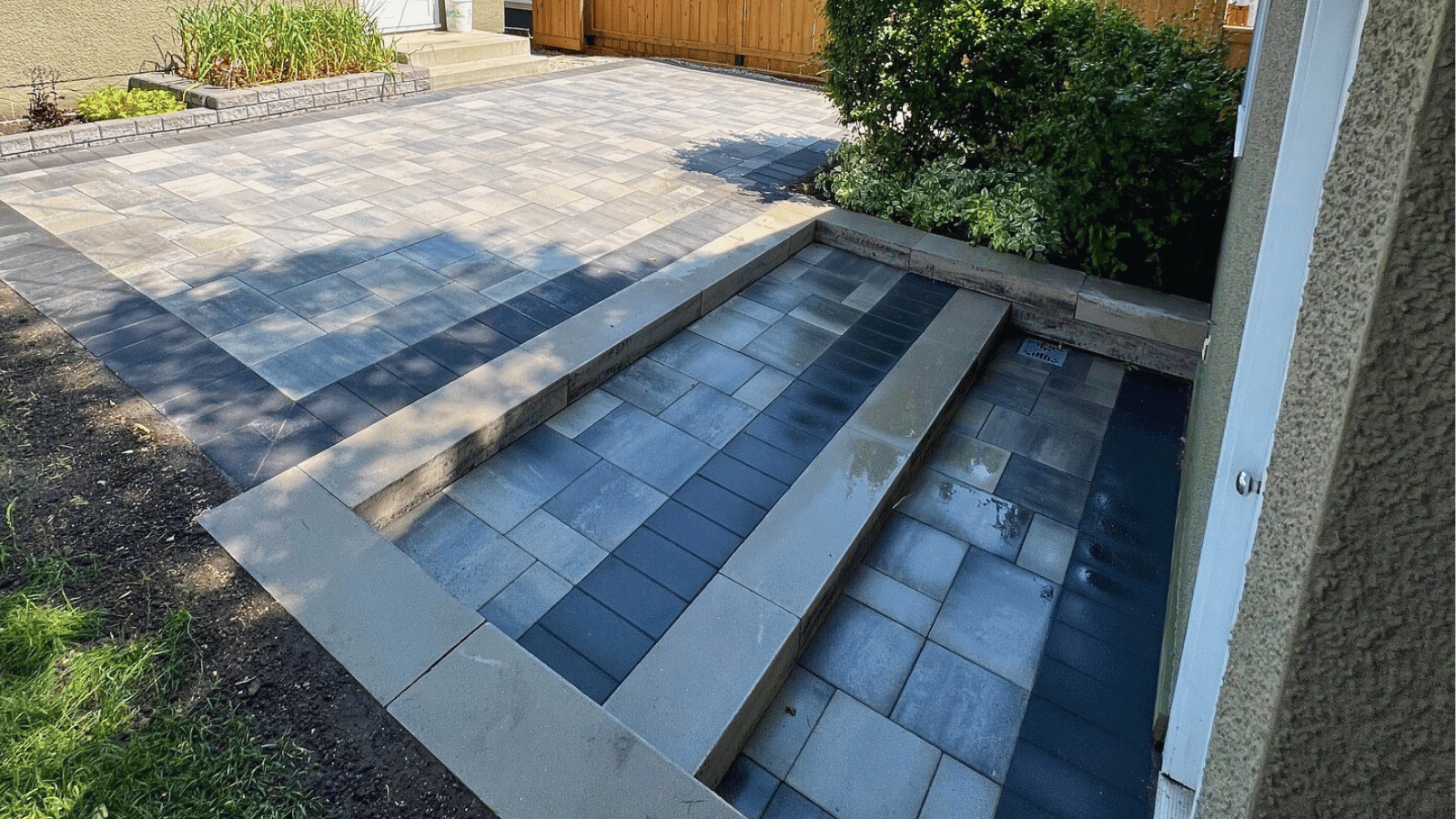 Paver patio and stone walkway under construction