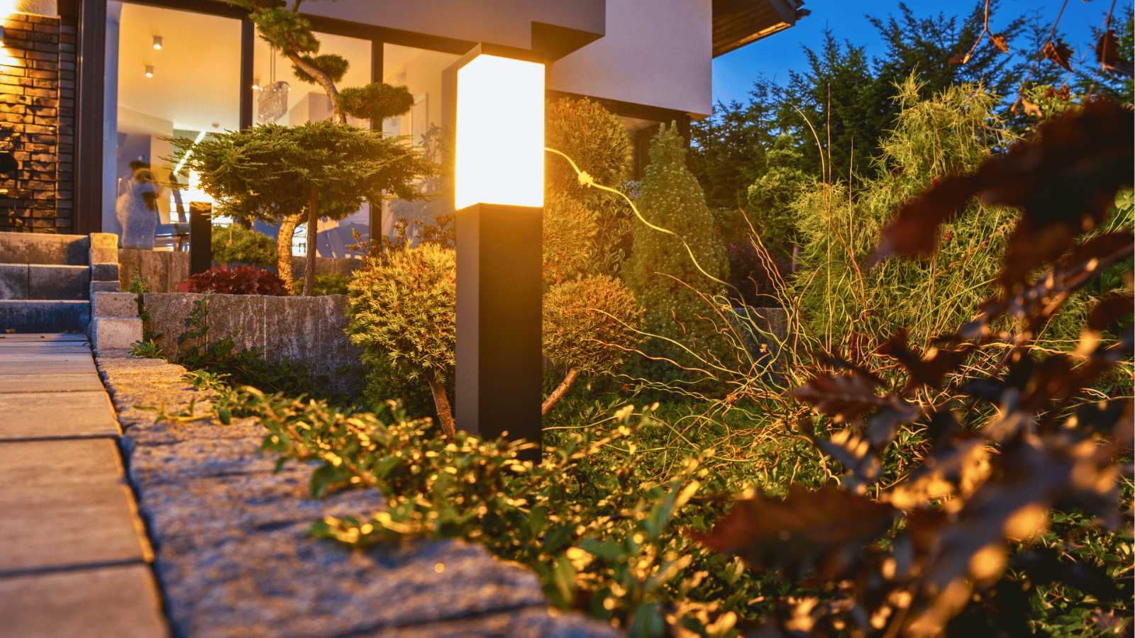 All The Moore Landscaping team installing pathway lights