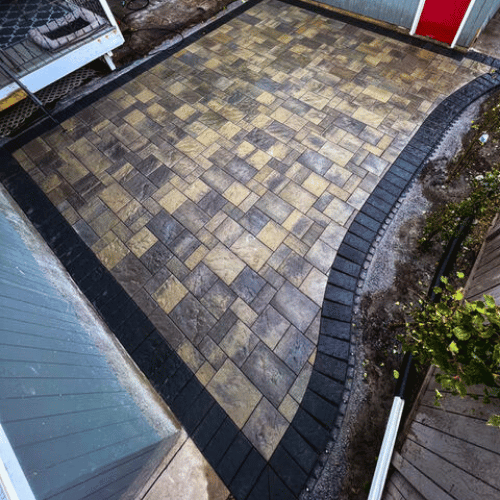 Completed patio and walkway installation by All The Moore Landscaping